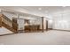 Basement with a bar and an open area with stairs at 1462 Eagle Trace Ct, Greenwood, IN 46143