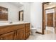 Bathroom with a single sink vanity featuring wood cabinets at 1462 Eagle Trace Ct, Greenwood, IN 46143