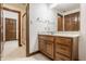 Bathroom with a single sink vanity with wood cabinets at 1462 Eagle Trace Ct, Greenwood, IN 46143