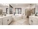 Bright bathroom featuring dual vanities, a soaking tub, and a glass-enclosed shower at 1462 Eagle Trace Ct, Greenwood, IN 46143