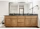 Bathroom featuring a double vanity with a black countertop at 1462 Eagle Trace Ct, Greenwood, IN 46143