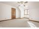 This carpeted bedroom features a ceiling fan and a bright window at 1462 Eagle Trace Ct, Greenwood, IN 46143