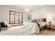 Bedroom features a large window, comfortable furnishings, and a decorative chandelier at 1462 Eagle Trace Ct, Greenwood, IN 46143