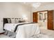 Cozy bedroom with a comfortable bed, chandelier, and access to the main bathroom at 1462 Eagle Trace Ct, Greenwood, IN 46143