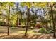 Charming brick home exterior surrounded by mature trees and lush greenery for enhanced curb appeal at 1462 Eagle Trace Ct, Greenwood, IN 46143