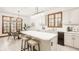 Open kitchen with an island, breakfast bar, and a dining area featuring a decorative chandelier at 1462 Eagle Trace Ct, Greenwood, IN 46143