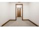 Neutral room with light carpet and trim, perfect for a home office or storage at 1462 Eagle Trace Ct, Greenwood, IN 46143