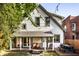 Charming home with a covered porch, backyard patio, and well-maintained landscaping at 545 Fletcher Ave, Indianapolis, IN 46203