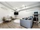 Inviting basement with a comfortable couch, television, and unique decor, great for relaxing and fun at 545 Fletcher Ave, Indianapolis, IN 46203
