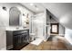 Bathroom featuring tile floors, vanity, and walk-in shower at 545 Fletcher Ave, Indianapolis, IN 46203