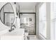 Well-lit bathroom with white vanity, sleek fixtures, and a modern glass-enclosed shower at 545 Fletcher Ave, Indianapolis, IN 46203