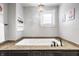 Bathroom features a large soaking tub with granite countertops and modern fixtures at 545 Fletcher Ave, Indianapolis, IN 46203