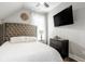 Comfortable bedroom with neutral tones, decorative accents, and a ceiling fan at 545 Fletcher Ave, Indianapolis, IN 46203