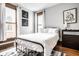 Cozy bedroom with modern decor, natural light, and a comfortable bed setup at 545 Fletcher Ave, Indianapolis, IN 46203