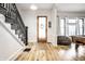 Inviting entryway with wood floors, staircase, and ample natural light at 545 Fletcher Ave, Indianapolis, IN 46203