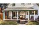 Inviting front porch with chairs and double door entrance featuring an outdoor seating area at 545 Fletcher Ave, Indianapolis, IN 46203
