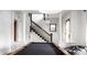 Well-lit game room featuring a pool table and staircase with white columns and black railings at 545 Fletcher Ave, Indianapolis, IN 46203