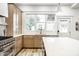 Beautifully updated kitchen with stainless steel appliances, a large island, and ample natural light at 545 Fletcher Ave, Indianapolis, IN 46203