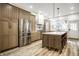 Modern kitchen with wood cabinets, stainless steel appliances, and a spacious center island at 545 Fletcher Ave, Indianapolis, IN 46203