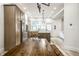 Spacious open-concept kitchen with custom cabinetry, stainless steel appliances, island, and adjacent dining area at 545 Fletcher Ave, Indianapolis, IN 46203