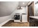 Laundry room with washer, dryer, and vanity at 545 Fletcher Ave, Indianapolis, IN 46203