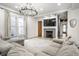 Spacious living room features fireplace, large windows, stylish lighting, and comfortable seating at 545 Fletcher Ave, Indianapolis, IN 46203