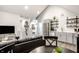 Open-concept living space featuring stainless steel appliances and an adjacent living area, ideal for entertaining at 545 Fletcher Ave, Indianapolis, IN 46203