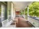 Relaxing porch with wooden flooring and comfortable white chairs at 545 Fletcher Ave, Indianapolis, IN 46203