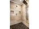 Modern shower featuring a large rain shower head, pebble tile floor, and wall jets at 545 Fletcher Ave, Indianapolis, IN 46203