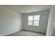 Cozy bedroom featuring neutral carpeting and a large window for natural light at 2170 Warbler St, Danville, IN 46122