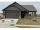 Beautiful single-Gathering home with a two-car garage, stylish siding, and a well-manicured lawn at 2170 Warbler St, Danville, IN 46122