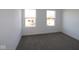 Bedroom with two windows offering natural light and carpet flooring at 3912 Highcrest Rd, Indianapolis, IN 46239