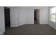 Bright bedroom with gray carpeting and access to a bathroom and closet at 3912 Highcrest Rd, Indianapolis, IN 46239