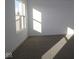 Spacious bedroom with gray carpeting and large window at 3912 Highcrest Rd, Indianapolis, IN 46239