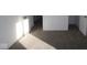 Well-lit bedroom with gray carpeting and two doors at 3912 Highcrest Rd, Indianapolis, IN 46239