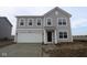 Two-story house with gray siding, white garage door, and a small front yard at 3912 Highcrest Rd, Indianapolis, IN 46239