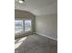 Bedroom with neutral paint, carpet, and two windows at 424 N Kealing Ave, Indianapolis, IN 46201