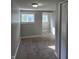 Bedroom featuring two windows and access to the closet with paneled doors at 424 N Kealing Ave, Indianapolis, IN 46201