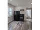 Kitchen featuring black appliances, including a refrigerator and stove at 424 N Kealing Ave, Indianapolis, IN 46201