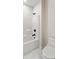 Clean bathroom area featuring a tiled bathtub, shower, and toilet at 5143 Oak Ridge Pl, Columbus, IN 47201