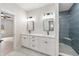 Bathroom with double vanity, shower and neutral gray tile floor at 5143 Oak Ridge Pl, Columbus, IN 47201