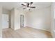 Bedroom featuring a ceiling fan, light-colored walls, and wood-look flooring at 5143 Oak Ridge Pl, Columbus, IN 47201