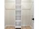 Walk-in closet featuring built-in shelving and hanging rods for organization at 5143 Oak Ridge Pl, Columbus, IN 47201