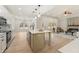Bright, open-concept kitchen featuring a large island, stainless appliances, and hardwood floors throughout the home at 5143 Oak Ridge Pl, Columbus, IN 47201