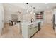 Open-concept kitchen and living area featuring a stylish island, modern appliances, and seamless flow for entertaining at 5143 Oak Ridge Pl, Columbus, IN 47201