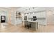 Modern kitchen with stainless steel appliances, a large island, pendant lighting, and tiled backsplash, with an open concept at 5143 Oak Ridge Pl, Columbus, IN 47201