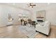 Bright living room featuring a modern fireplace, vaulted ceilings, stylish furniture, and natural light from large windows at 5143 Oak Ridge Pl, Columbus, IN 47201
