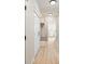 Mudroom featuring a built-in storage bench, coat hooks, and wood-look floors at 5143 Oak Ridge Pl, Columbus, IN 47201