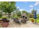 Spacious outdoor patio with an outdoor fireplace and ample seating perfect for outdoor entertaining at 10346 Strongbow Rd, Fishers, IN 46040