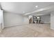 Large finished basement with ample space and stairs leading to a kitchenette at 10346 Strongbow Rd, Fishers, IN 46040